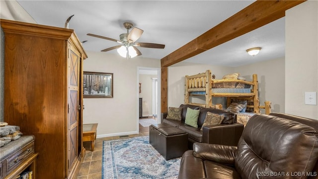 bedroom with beamed ceiling, baseboards, and tile patterned flooring