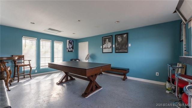 recreation room featuring baseboards and visible vents