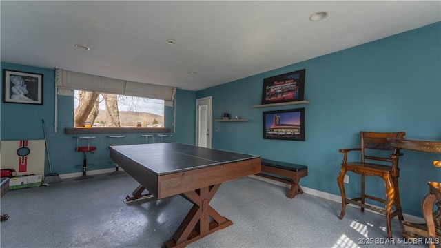 rec room with speckled floor and baseboards