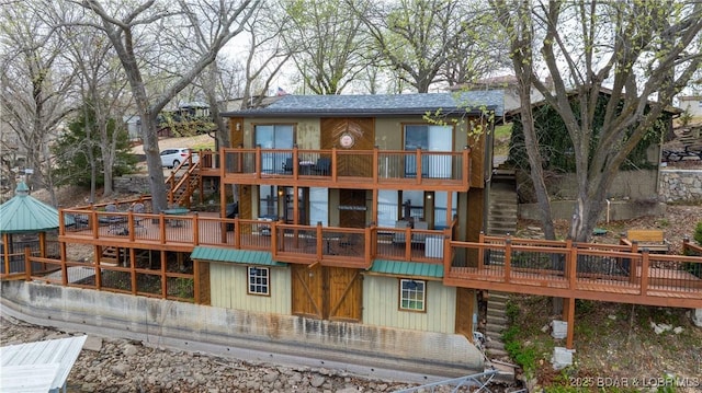 rear view of property with a deck