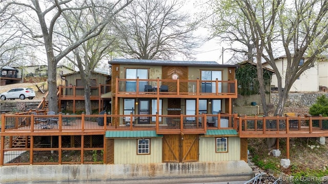 back of house featuring a deck