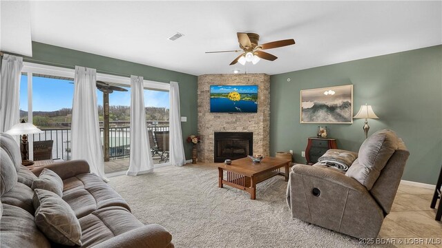 364 Cedar Heights Dr Unit 2B, Camdenton, MO 65020 - living room featuring a ceiling fan and a stone fireplace