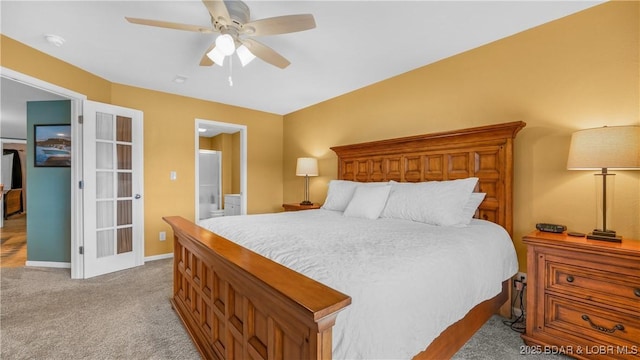 364 Cedar Heights Dr Unit 2B, Camdenton, MO 65020 - bedroom with light colored carpet, french doors, connected bathroom, and a ceiling fan