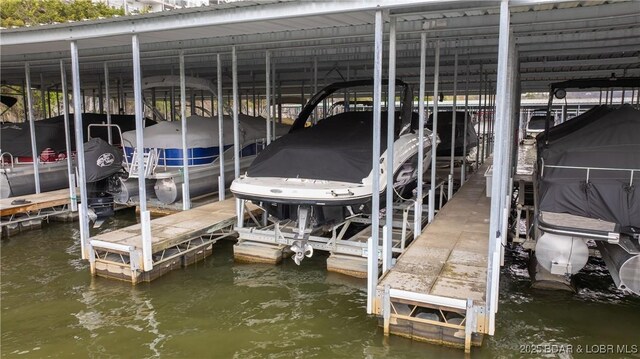 364 Cedar Heights Dr Unit 2B, Camdenton, MO 65020 - dock with boat lift and a water view