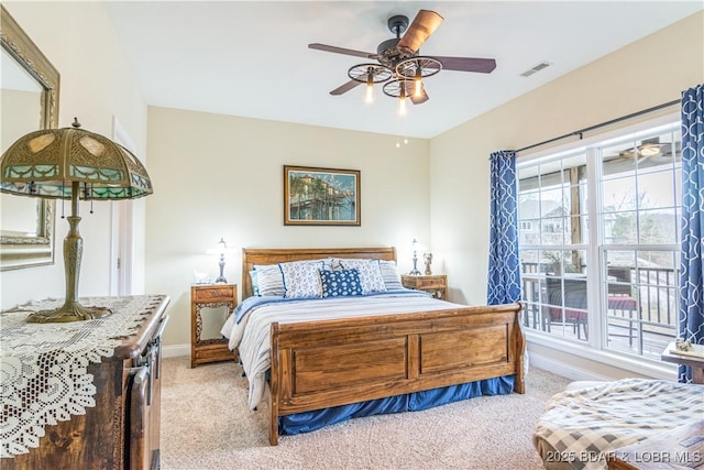 bedroom featuring light colored carpet, baseboards, and a ceiling fan