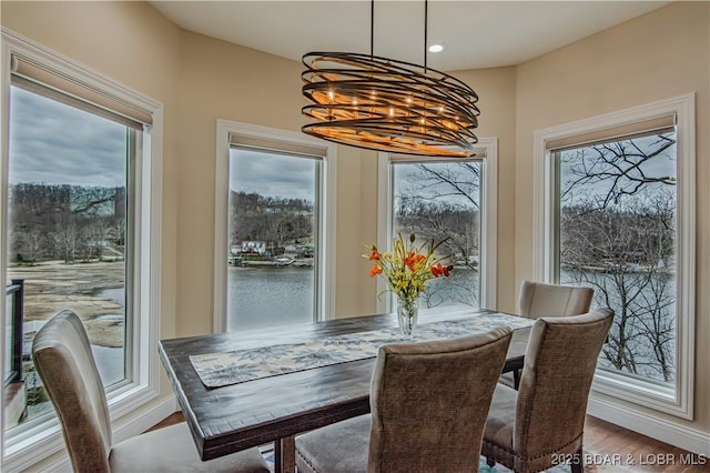 dining room featuring a chandelier, wood finished floors, and recessed lighting