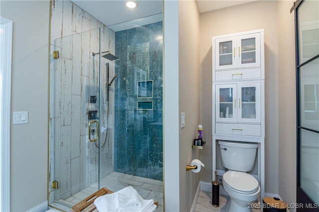 full bathroom with a shower stall, toilet, baseboards, and recessed lighting