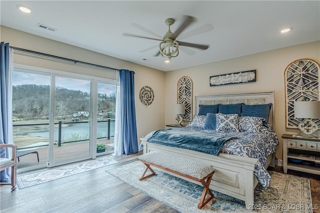 bedroom with access to outside, wood finished floors, recessed lighting, and a ceiling fan