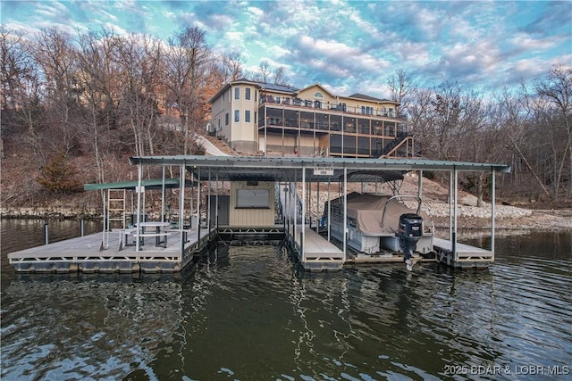 dock featuring a water view, boat lift, and stairway