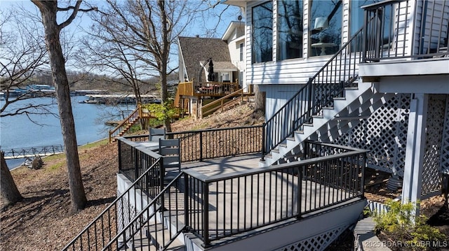 exterior space featuring a water view and stairway