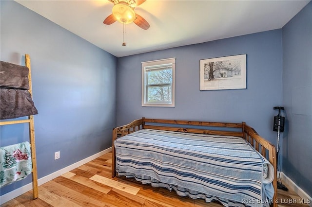 33724 Ivy Bnd, Stover, MO 65078 - bedroom featuring wood finished floors and ceiling fan