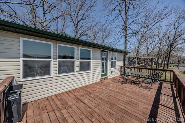 33724 Ivy Bnd, Stover, MO 65078 - wooden deck featuring outdoor dining space