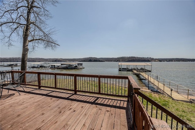 33724 Ivy Bnd, Stover, MO 65078 - deck featuring a water view and a floating dock