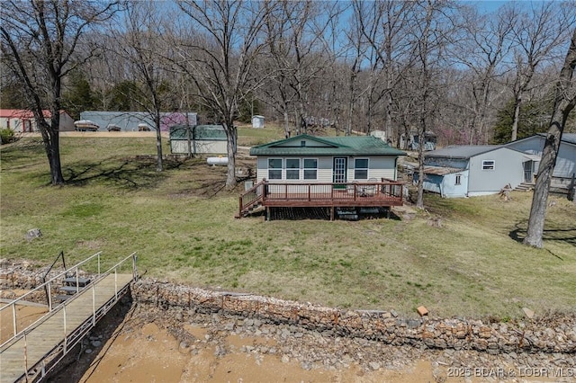 33724 Ivy Bnd, Stover, MO 65078 - rear view of house with a wooden deck, a yard, and a chimney