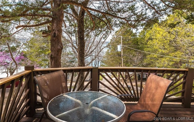 29829 Sheldy Dr, Rocky Mount, MO 65072 - view of wooden balcony featuring outdoor dining area and a deck