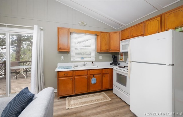 29829 Sheldy Dr, Rocky Mount, MO 65072 - kitchen featuring a sink, a wealth of natural light, white appliances, and vaulted ceiling