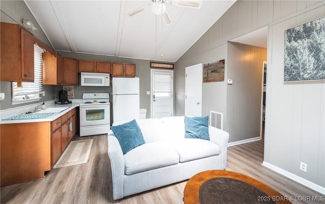 29829 Sheldy Dr, Rocky Mount, MO 65072 - kitchen with visible vents, light countertops, a ceiling fan, white appliances, and lofted ceiling