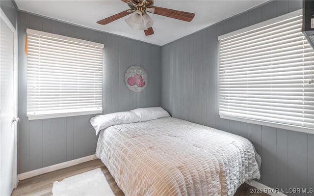 29829 Sheldy Dr, Rocky Mount, MO 65072 - bedroom featuring wood finished floors, ceiling fan, and baseboards