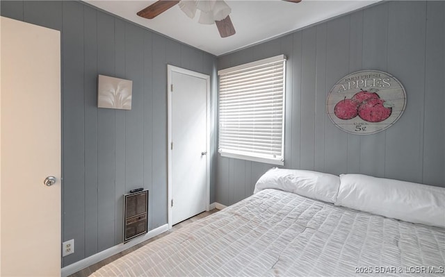 29829 Sheldy Dr, Rocky Mount, MO 65072 - bedroom featuring baseboards, heating unit, and ceiling fan