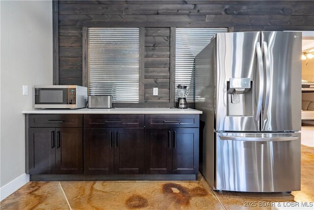 613 Cove Cir, Sunrise Beach, MO 65079 - bar with appliances with stainless steel finishes and baseboards