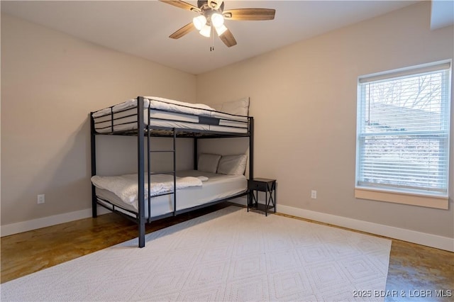 613 Cove Cir, Sunrise Beach, MO 65079 - bedroom featuring baseboards and ceiling fan