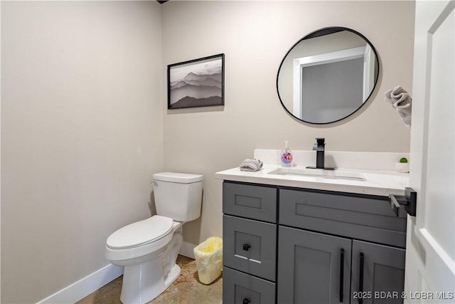 613 Cove Cir, Sunrise Beach, MO 65079 - bathroom with baseboards, toilet, and vanity