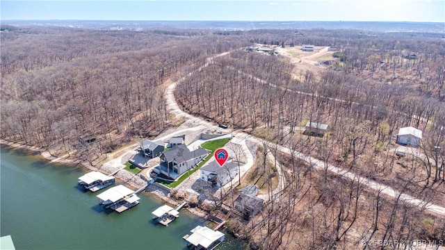 613 Cove Cir, Sunrise Beach, MO 65079 - aerial view of property's location with a forest and a large body of water