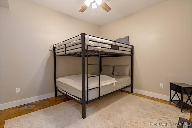 613 Cove Cir, Sunrise Beach, MO 65079 - bedroom featuring baseboards and a ceiling fan