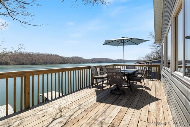 34524 Ivy Bend Rd, Stover, MO 65078 - wooden terrace with outdoor dining area and a water view