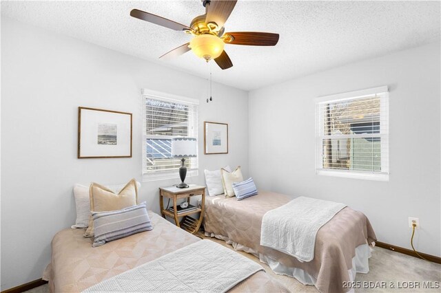 31372 Golden Wood Rd, Gravois Mills, MO 65037 - bedroom with ceiling fan, a textured ceiling, carpet flooring, and baseboards