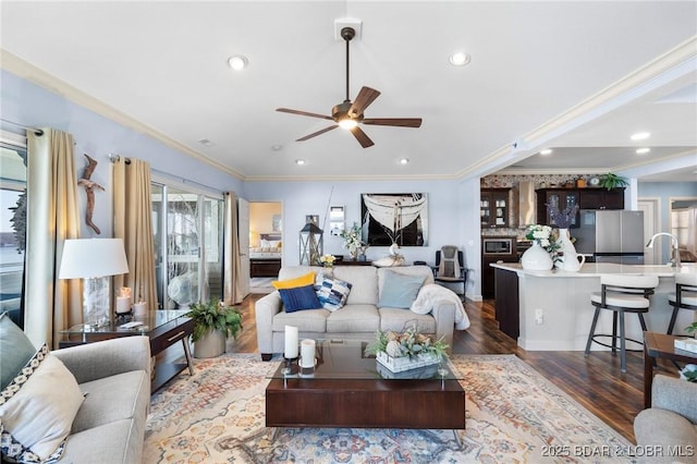 248 Palisades Condo Dr Unit 4A, Lake Ozark, MO 65049 - living area featuring dark wood finished floors, ceiling fan, crown molding, and recessed lighting