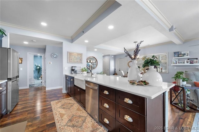 248 Palisades Condo Dr Unit 4A, Lake Ozark, MO 65049 - kitchen featuring stainless steel appliances, ornamental molding, light countertops, dark wood-style floors, and a peninsula