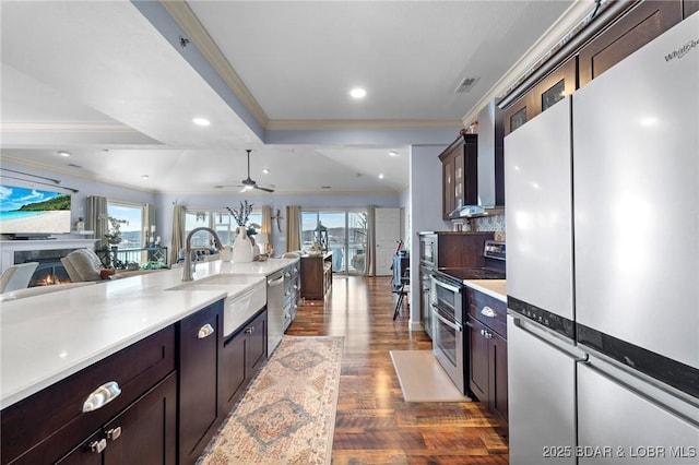 248 Palisades Condo Dr Unit 4A, Lake Ozark, MO 65049 - kitchen with stainless steel appliances, crown molding, dark wood-style flooring, plenty of natural light, and open floor plan