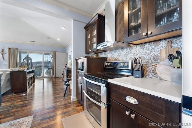 248 Palisades Condo Dr Unit 4A, Lake Ozark, MO 65049 - kitchen featuring stainless steel appliances, wall chimney range hood, ornamental molding, dark brown cabinets, and dark wood-style floors