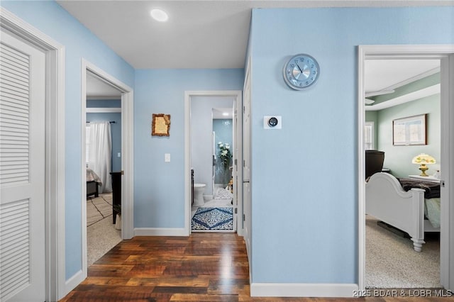 248 Palisades Condo Dr Unit 4A, Lake Ozark, MO 65049 - corridor with dark wood-style flooring and baseboards