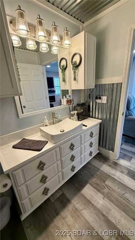 bathroom featuring vanity and wood finished floors