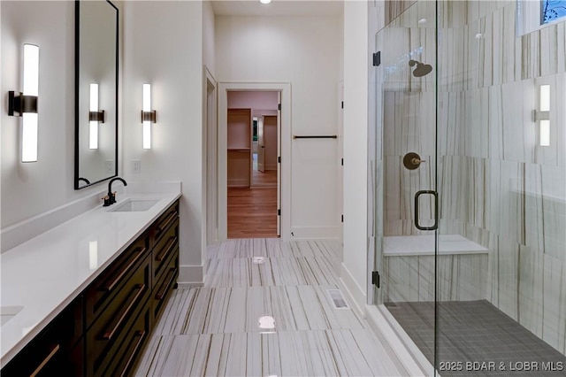 320 Via Appia Dr, Sunrise Beach, MO 65079 - full bath with double vanity, a stall shower, and baseboards