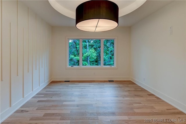 320 Via Appia Dr, Sunrise Beach, MO 65079 - unfurnished room featuring light wood-style floors and baseboards