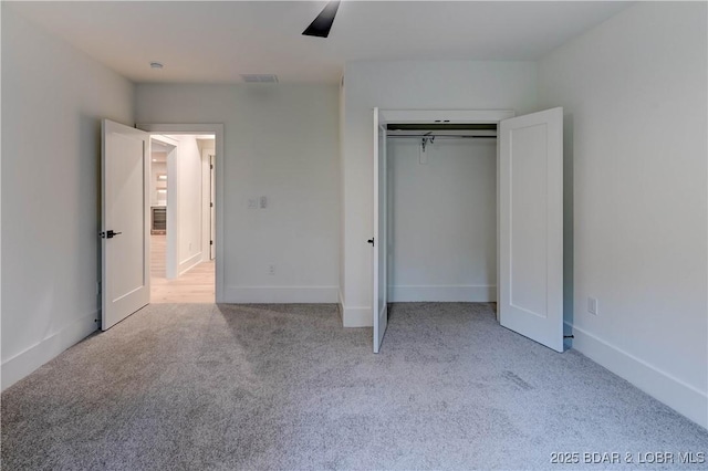 320 Via Appia Dr, Sunrise Beach, MO 65079 - unfurnished bedroom featuring carpet flooring, ceiling fan, a closet, and baseboards