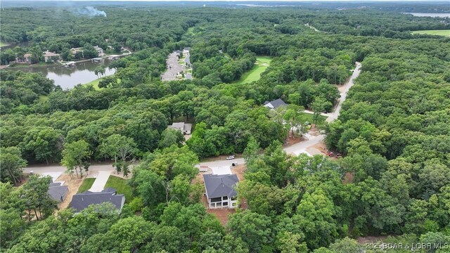 320 Via Appia Dr, Sunrise Beach, MO 65079 - aerial view of property's location with a heavily wooded area and a large body of water