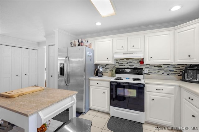 kitchen with stainless steel refrigerator with ice dispenser, range with electric cooktop, light countertops, under cabinet range hood, and white cabinetry