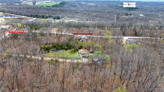 bird's eye view featuring a forest view
