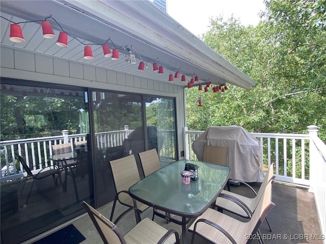 1505 Swiss Village Rd Unit A5, Osage Beach, MO 65065 - wooden terrace featuring outdoor dining space, a ceiling fan, and a grill