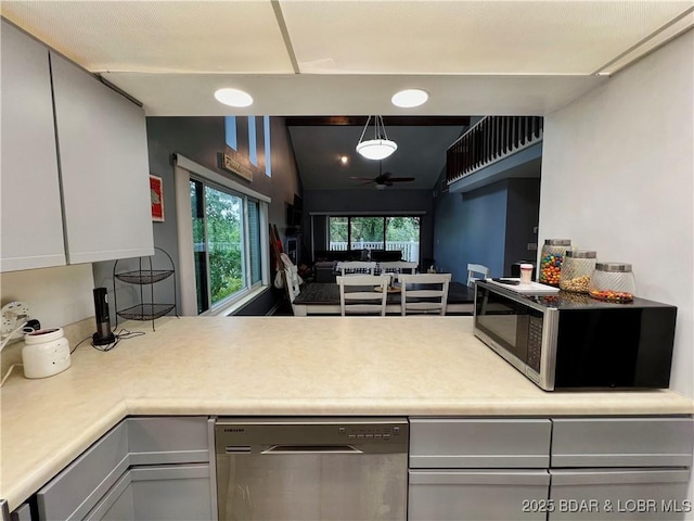 1505 Swiss Village Rd Unit A5, Osage Beach, MO 65065 - kitchen with stainless steel appliances, a ceiling fan, light countertops, gray cabinets, and a peninsula