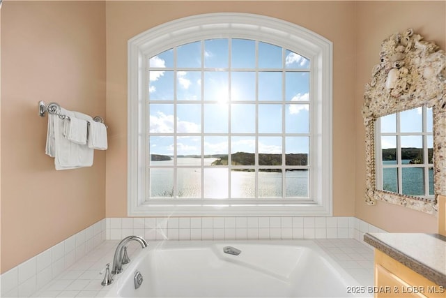 full bathroom with a water view and a garden tub