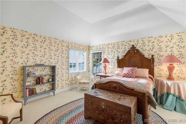 bedroom featuring carpet floors, wallpapered walls, and lofted ceiling