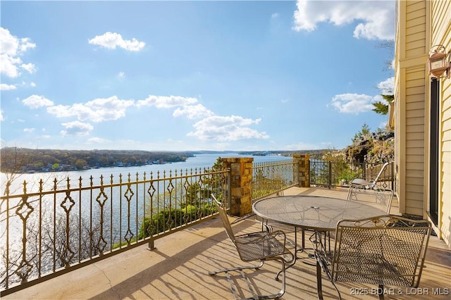 balcony featuring a water view