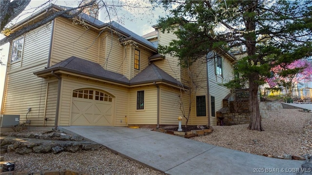 view of front of home featuring an attached garage and concrete driveway