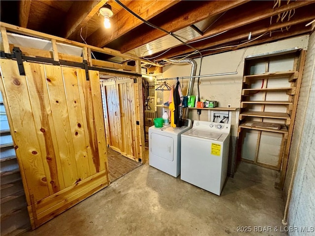 clothes washing area featuring washing machine and clothes dryer