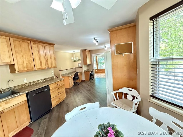 kitchen with dishwashing machine, a sink, light brown cabinets, dark wood-style floors, and a chandelier